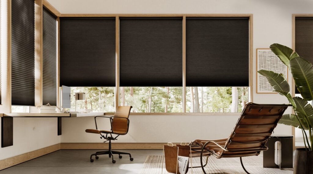 Applause® Honeycomb Shades in darker tones in an office