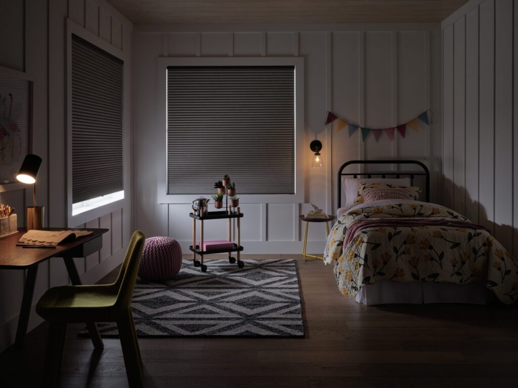 Applause® Honeycomb Shades in Vintage™ Café au Lait with room darkening and PowerView® Automation in a nursery